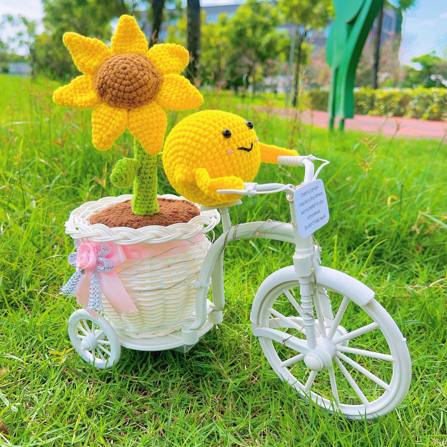 Whimsical Sunflower Pot on Bicycle: Hand-Woven Flower Basket with Sunflower Pen, LED Wire Wrap, and Positive Lemon Crochet Plushie