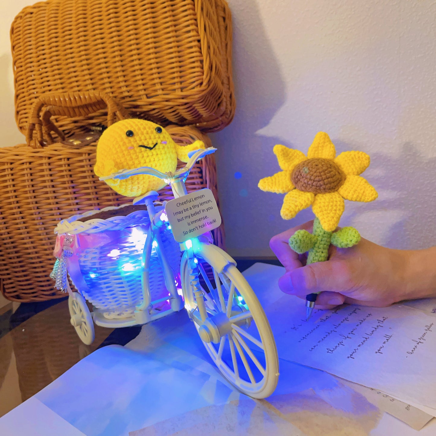 Whimsical Sunflower Pot on Bicycle: Hand-Woven Flower Basket with Sunflower Pen, LED Wire Wrap, and Positive Lemon Crochet Plushie