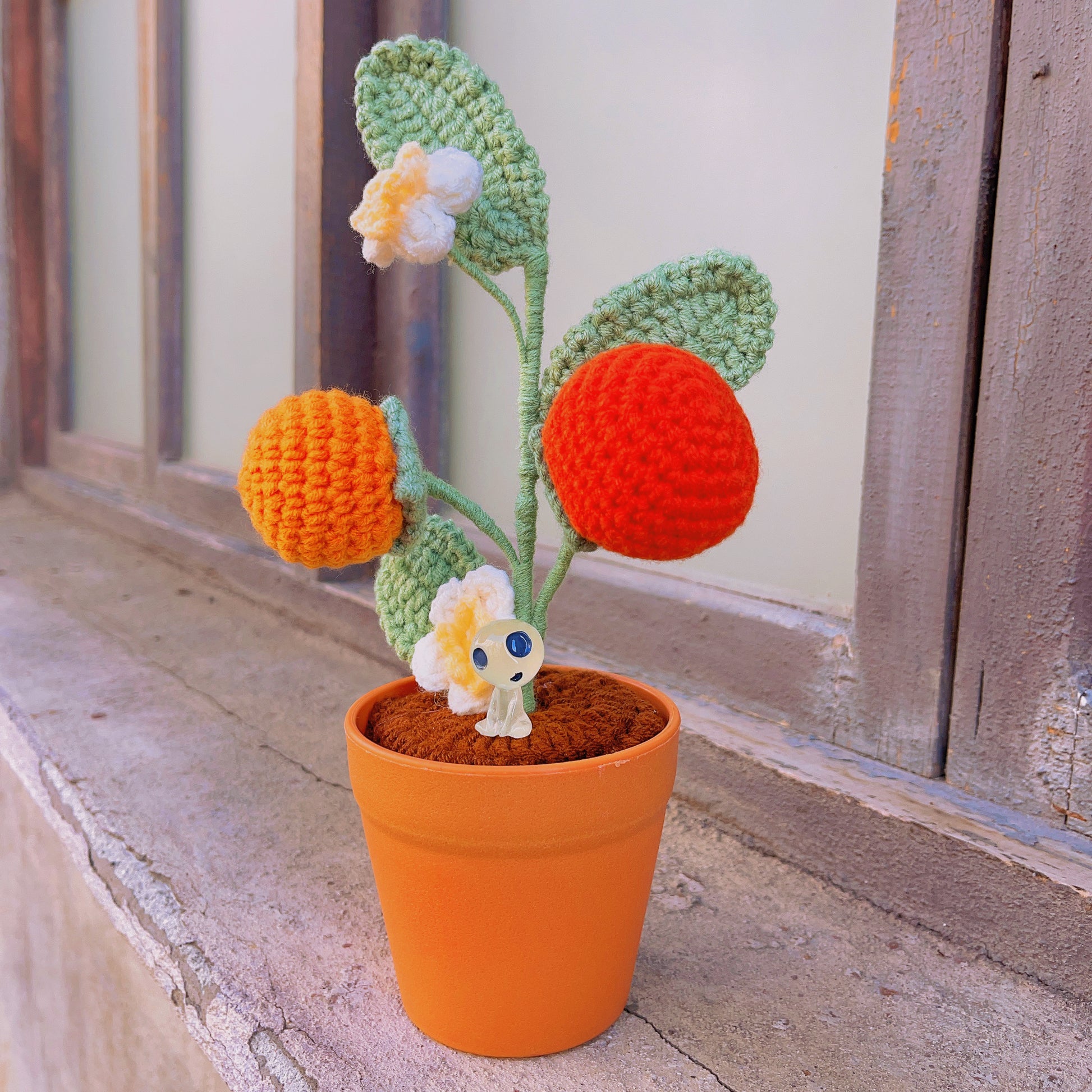 Handgefertigte gehäkelte Kakipflanze – realistische