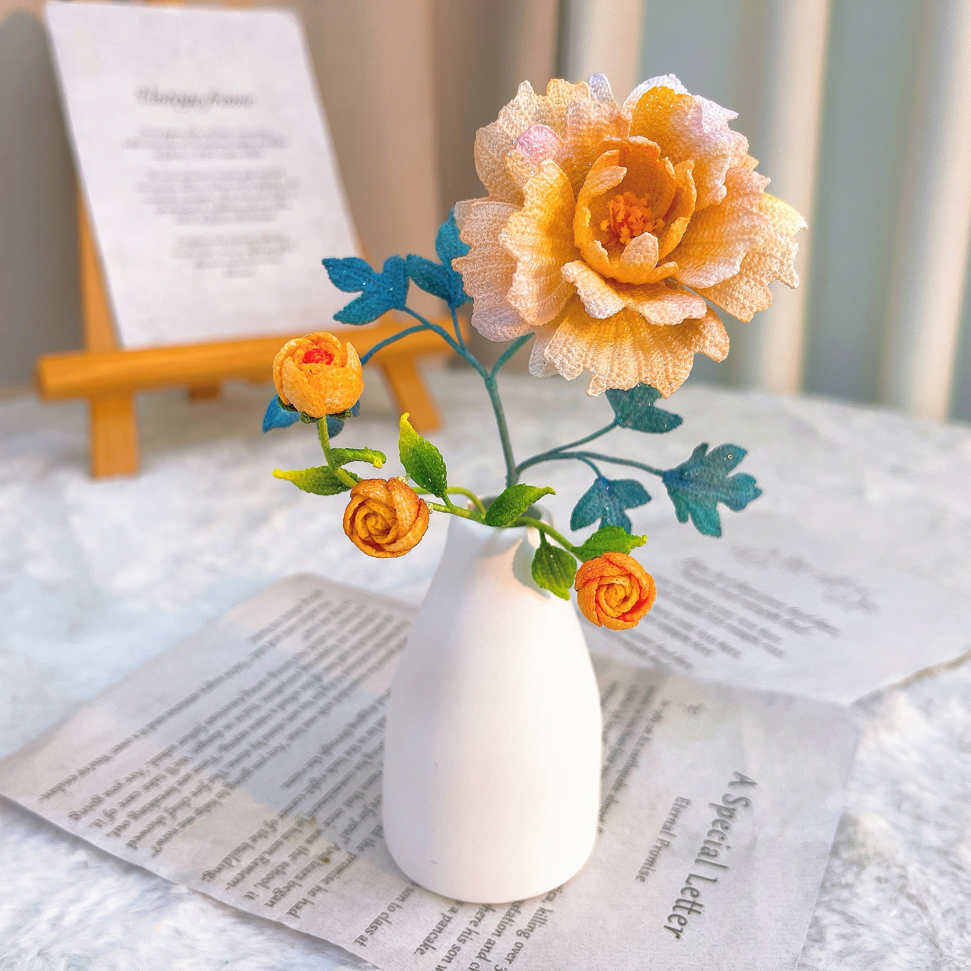 Small white vase with decorative micro crochet flowers 