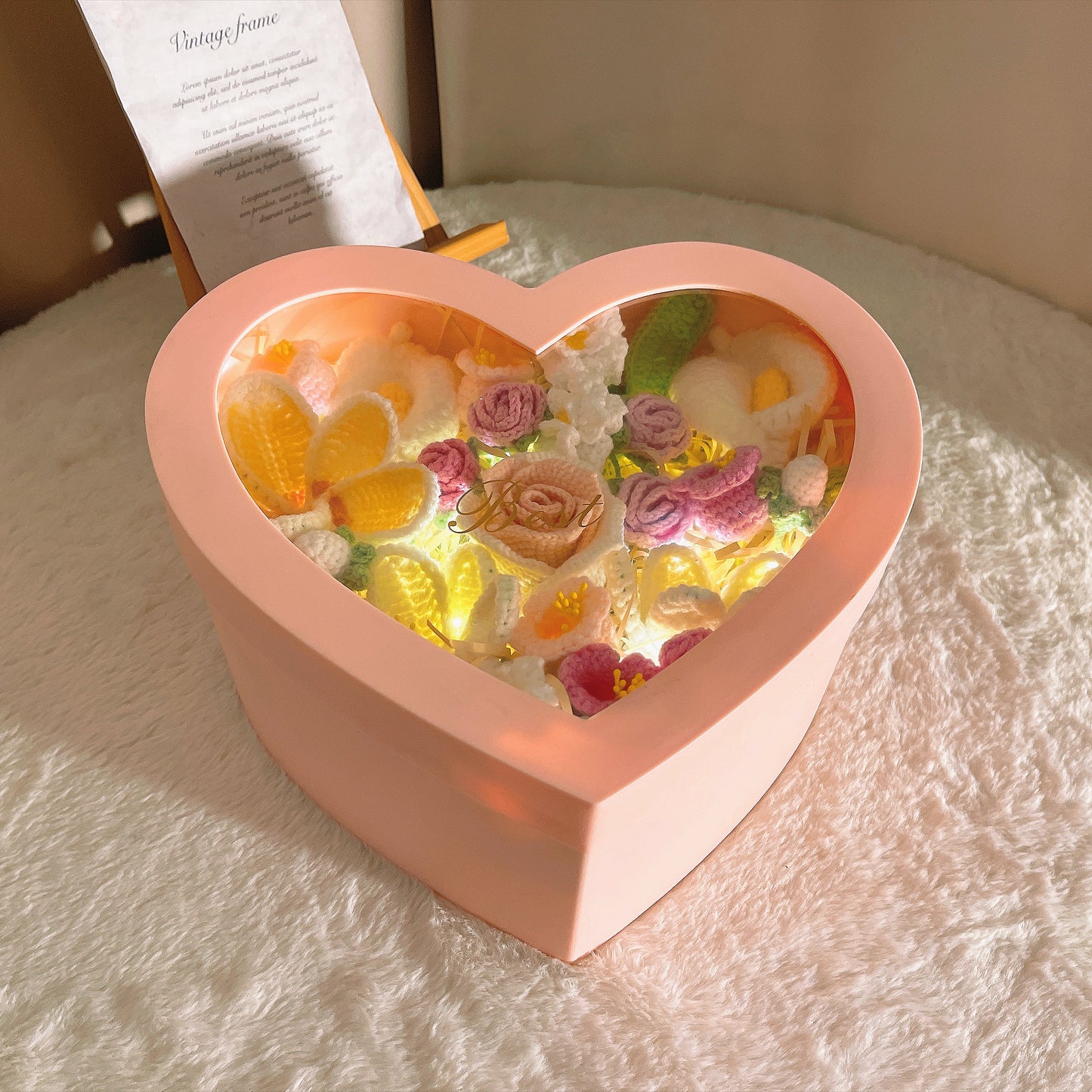 Handmade Crochet Flower Bouquet in Pink Heart-Shaped Plastic Box with LED Fairy Lights –&nbsp; &nbsp;Free Artificial Flowers with Beige Raffia Base&nbsp; – Perfect Valentine’s Day, Anniversary, Proposal, Birthday, or Mother’s Day Gift for Her