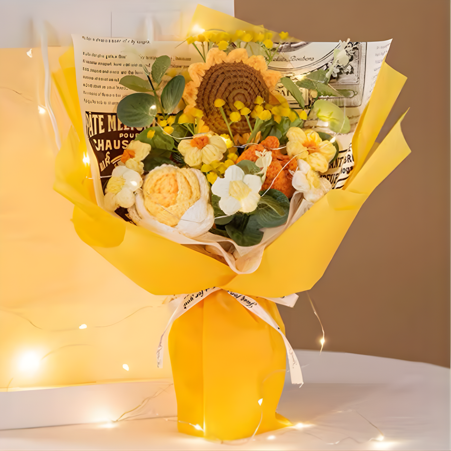 Bouquet of flowers with a yellow wrap on a white surface with a brown background