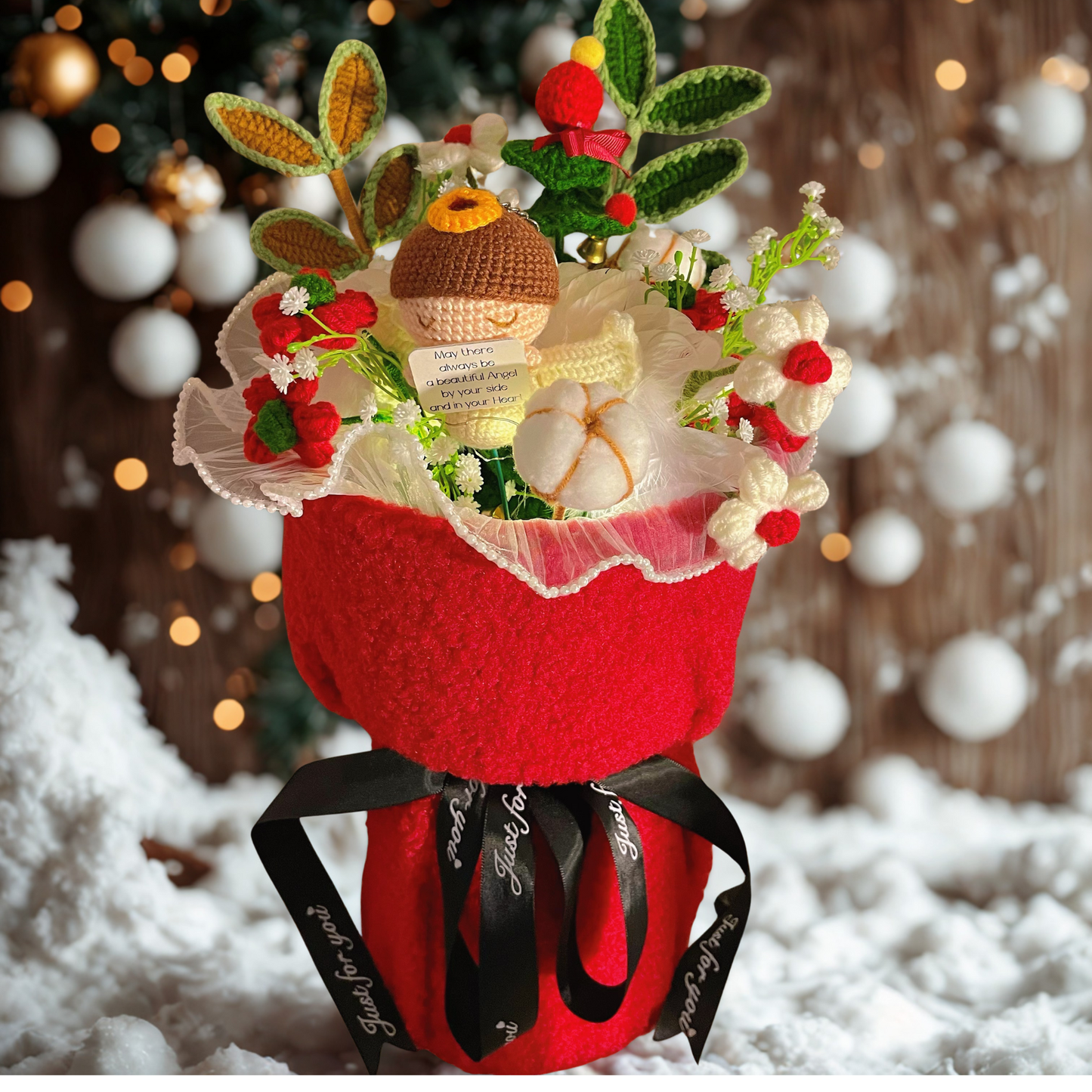 Decorative flower arrangement with a red vase, greenery, and red berries on a snowy background.