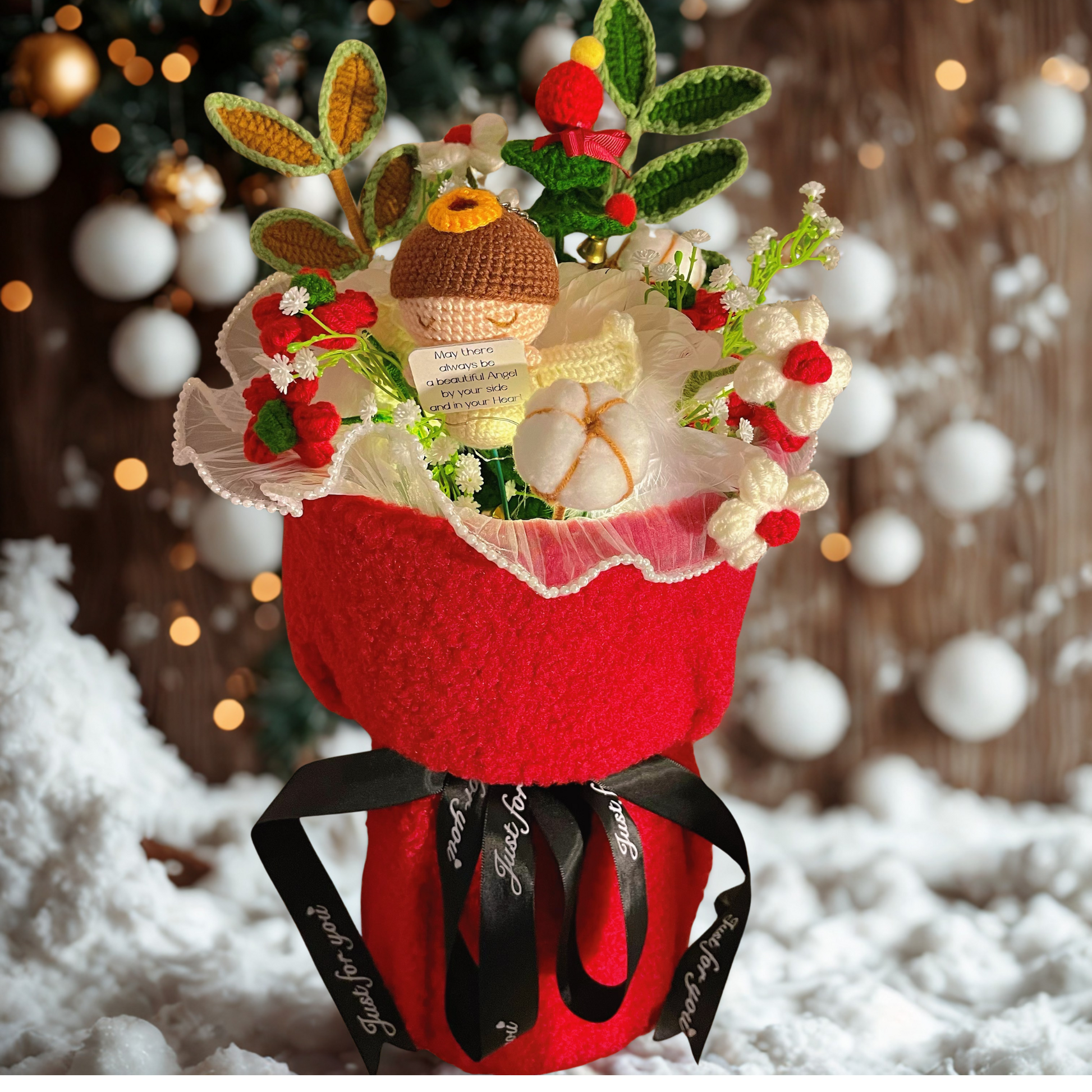 Decorative flower arrangement with a red vase, greenery, and red berries on a snowy background.